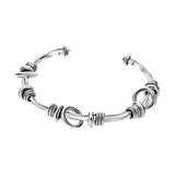 Brazalete Torcido Con Argollas De Plata